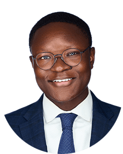 A portrait of a man wearing glasses and a suit.