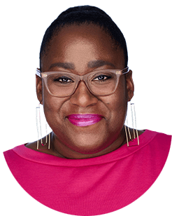 A black woman wearing glasses and a pink top.