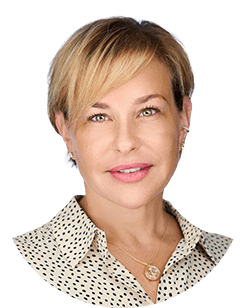 An image of a woman wearing a polka dot shirt.