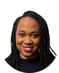 A black woman with braided hair smiling.