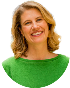 Headshot of a smiling woman with shoulder-length blonde hair wearing a green top.