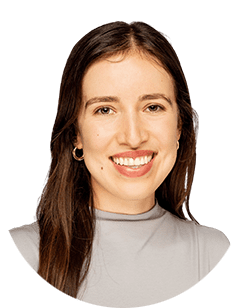 A smiling woman in a gray top.