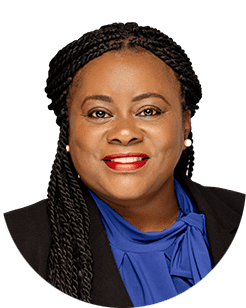 A black woman with braids in a blue shirt.