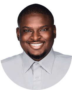 A smiling man in a grey shirt.