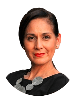 A woman with dark hair pulled back, wearing a black top and a silver necklace, looking directly at the camera.