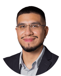 A portrait of a man wearing glasses and a suit.