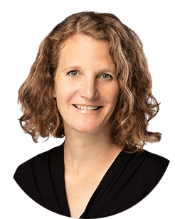 A portrait of a woman with curly hair.