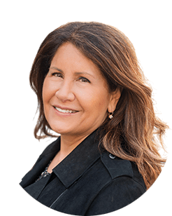 A woman in a black jacket smiling.