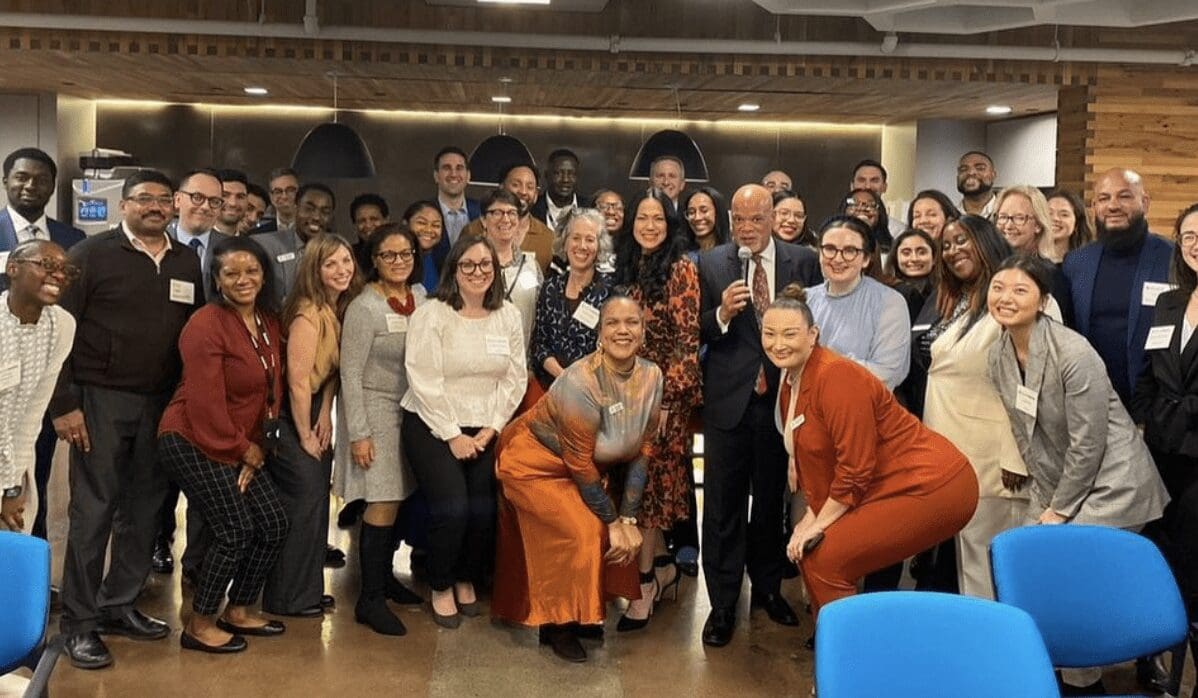 A group of people posing for a photo in an office.