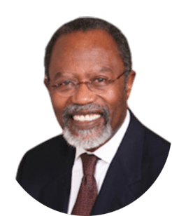 A smiling man in a suit and tie.