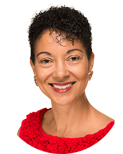 A woman with short hair smiling in a red top.