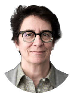 A woman wearing glasses and a gray shirt.