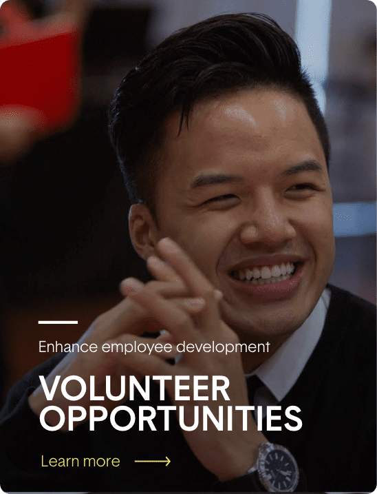 A smiling man with the text enhance employee development volunteer opportunities.