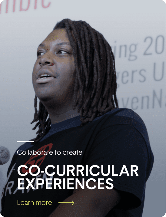 A woman with dreadlocks in front of a microphone with the words collaboration to create co-curricular experiences.