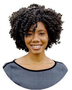 Portrait of a woman with curly hair, wearing a gray top, isolated on a white background.