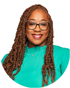 A person with long hair and glasses wearing a green top smiles at the camera.