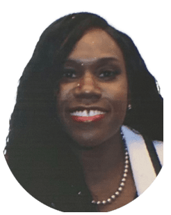 Portrait of a smiling person with long dark hair wearing a pearl necklace and a white top.