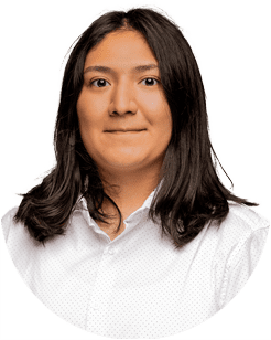 Person with long dark hair wearing a white collared shirt, smiling slightly in a portrait-style photo.