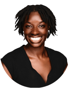 Woman with short, textured hair and a wide smile, wearing a sleeveless black top, posed against a plain white background.