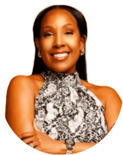Woman with long dark hair smiles, wearing a sleeveless black and white patterned top, a watch, and earrings, with her arms crossed in front of a plain background.