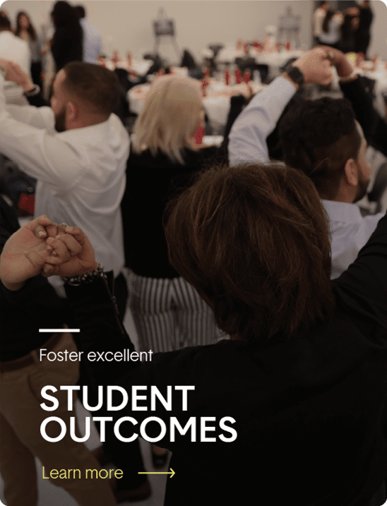 A group of people stand in a room, raising their clasped hands together. The text overlay reads: "Foster excellent student outcomes. Learn more.