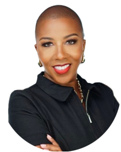 A woman with a shaved head, wearing a black zip-up top and gold earrings, smiles at the camera against a plain background.