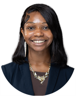 A young woman with straight black hair, wearing a dark blazer, a necklace, and a long earring, smiles at the camera against a plain light background.